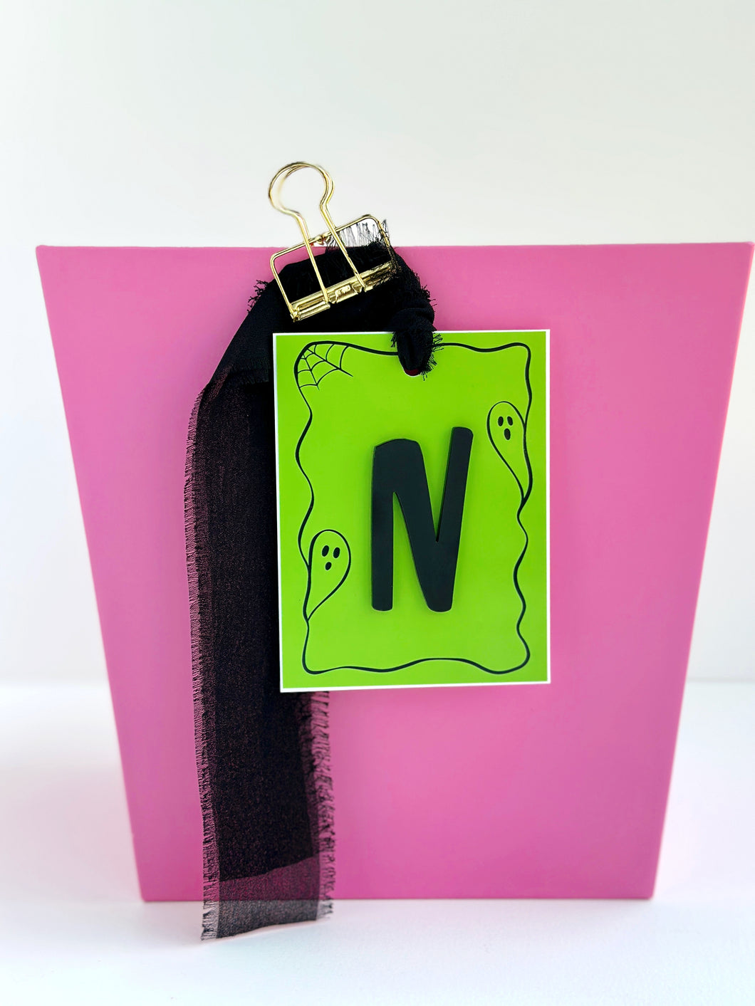 SpOoKtaCuLaR framed initial tag, bright green